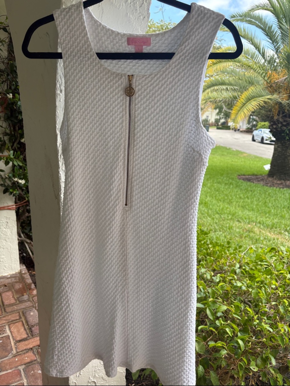 Lilly Pulitzer White Textured Sleeveless Mini Dress with Gold Zipper pull.